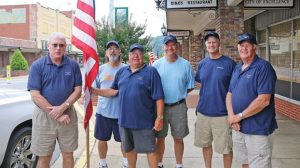 Kiwanis members with flags