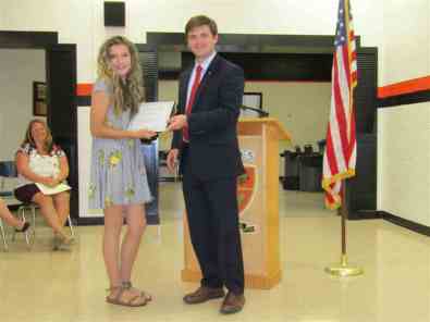 Kiwanis Club Adivisor Mitch Broyles presented the T.A. Dugger Builders Club Charter to the club’s first president, Izzy McQueen.